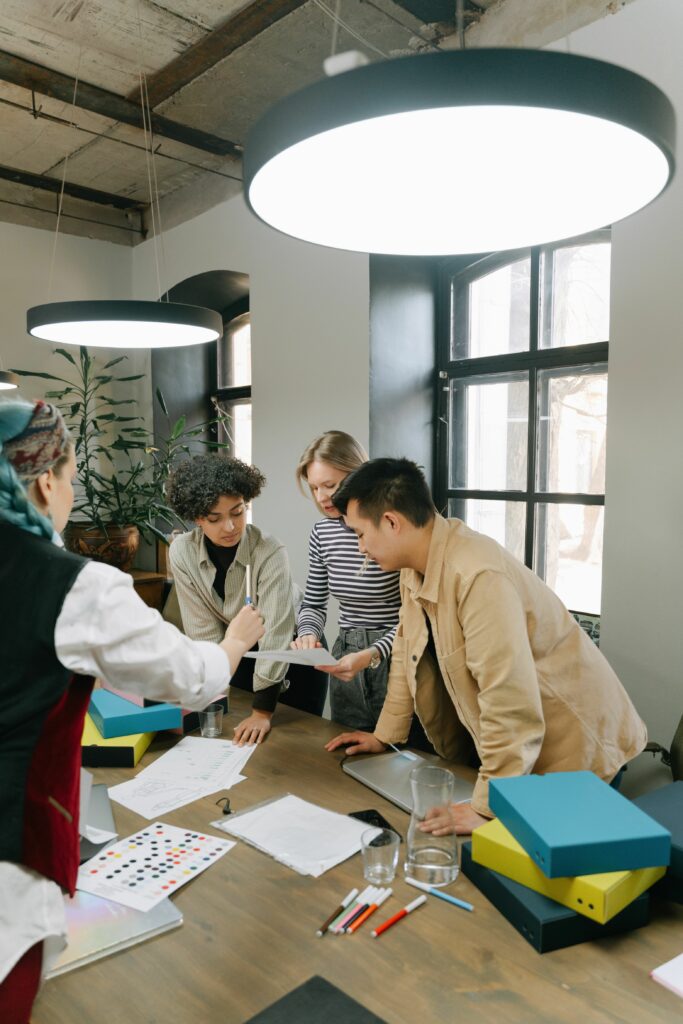 pexels photo 8117466 8117466 Diverse team of young professionals brainstorming together in a contemporary office setting.